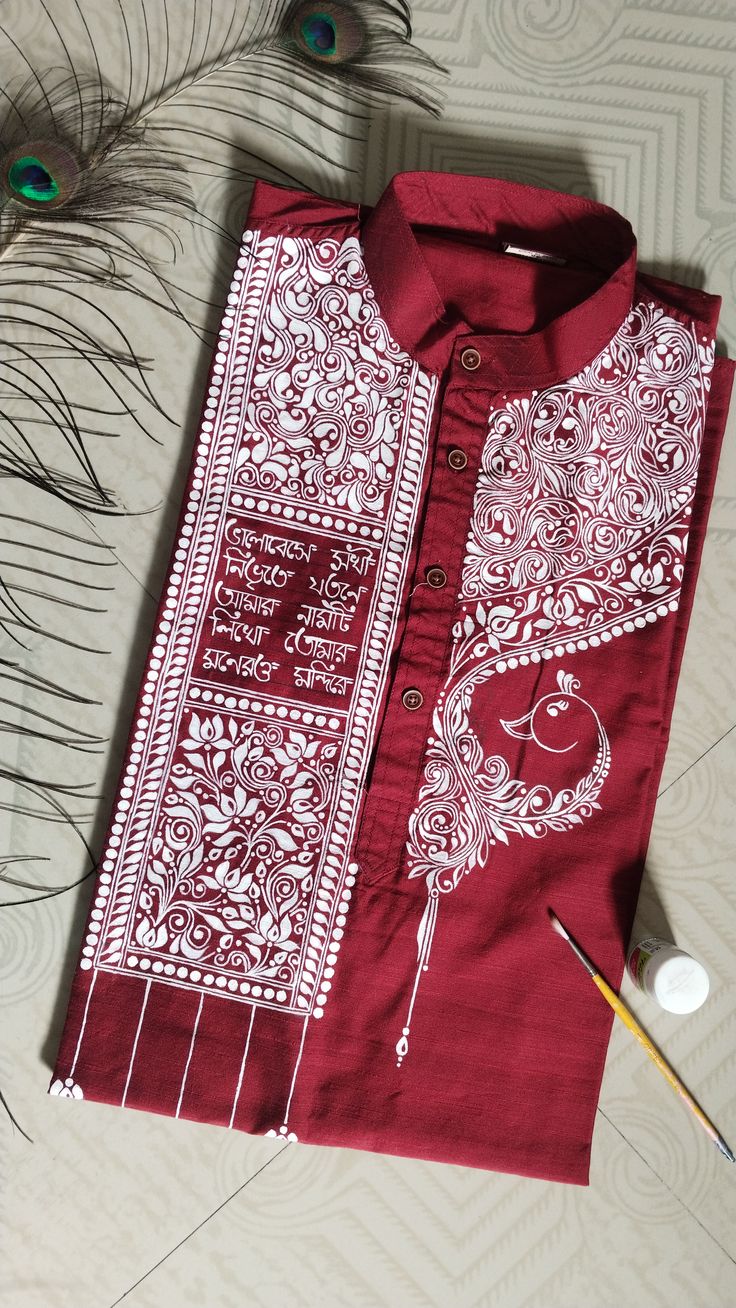 Hand-painted maroon Panjabi with intricate white Bengali folk art and peacock motif, featuring traditional calligraphy and floral patterns on premium cotton fabric.”
